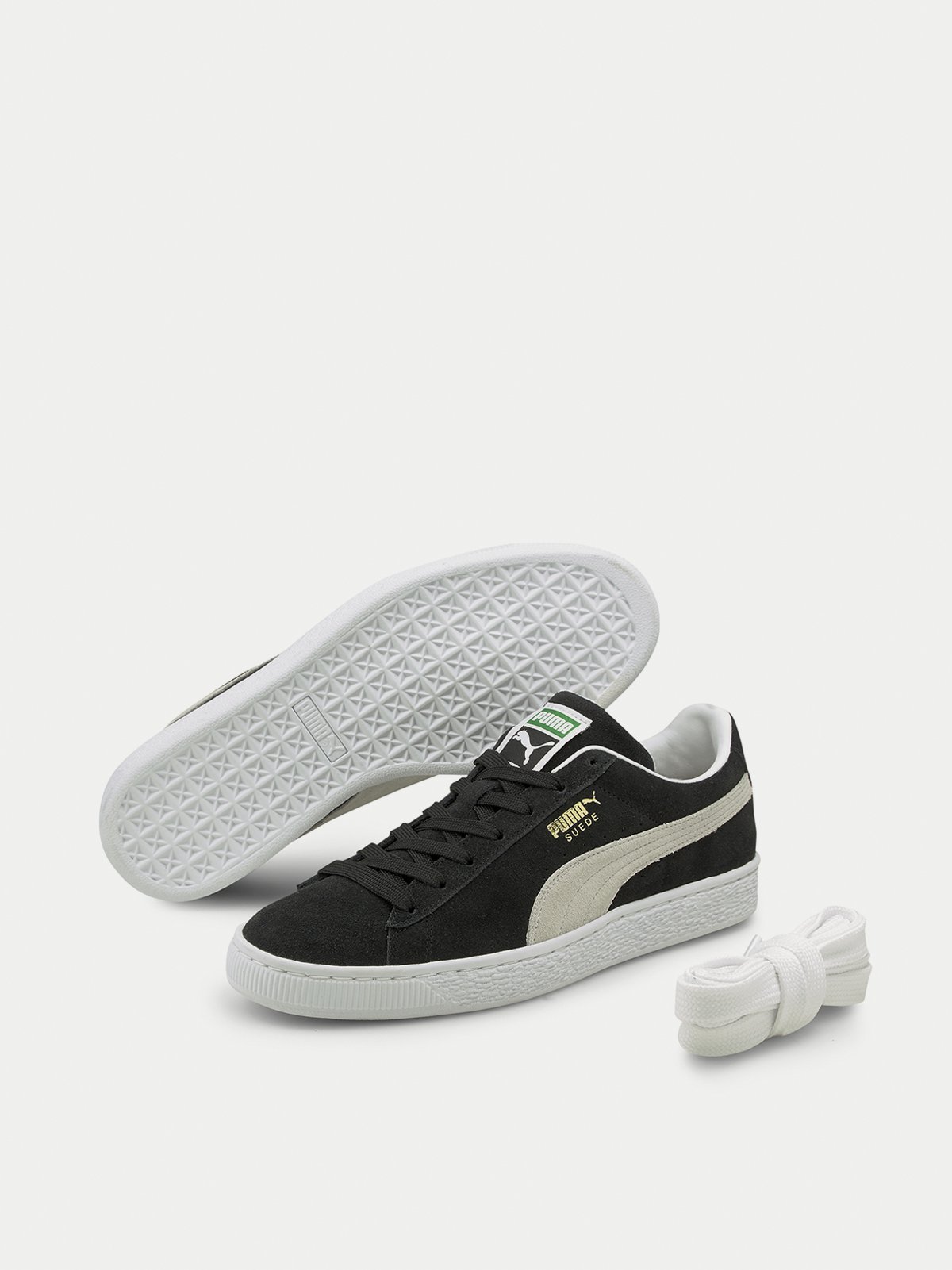 white and black pumas men's